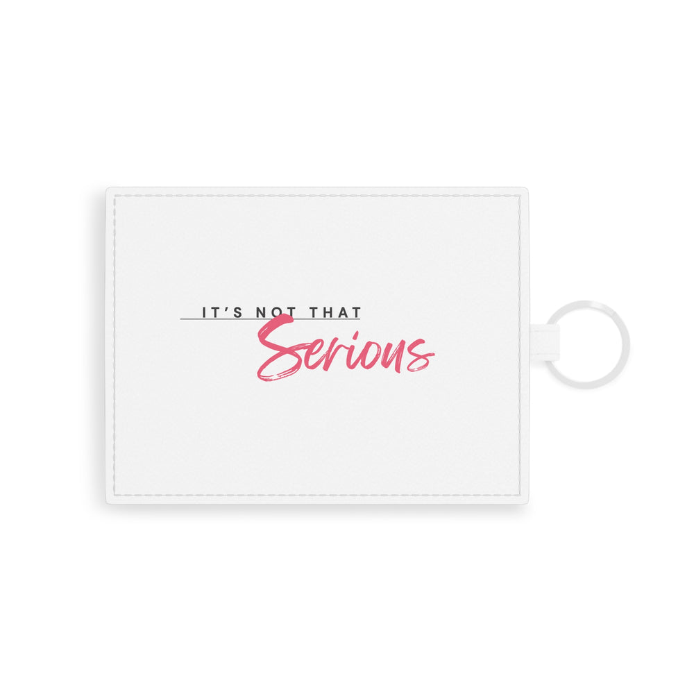 A white faux leather card holder with a red text design on one side, accompanied by a metal keyring.