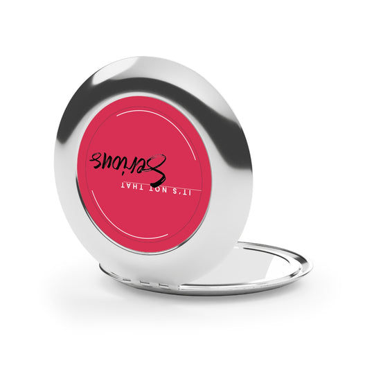 Silver phone stand with pink circular design featuring text on a white background