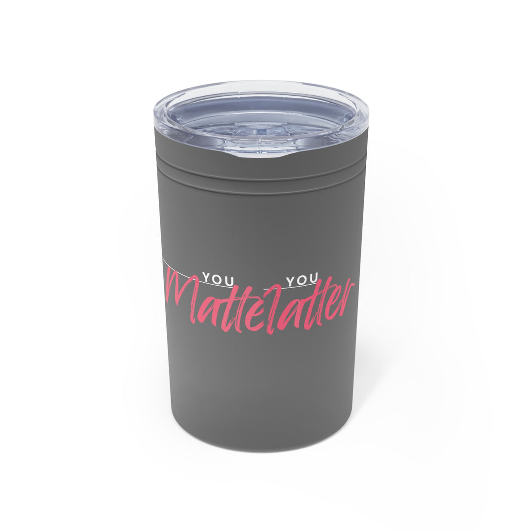 Gray tumbler with pink and white text on a white background