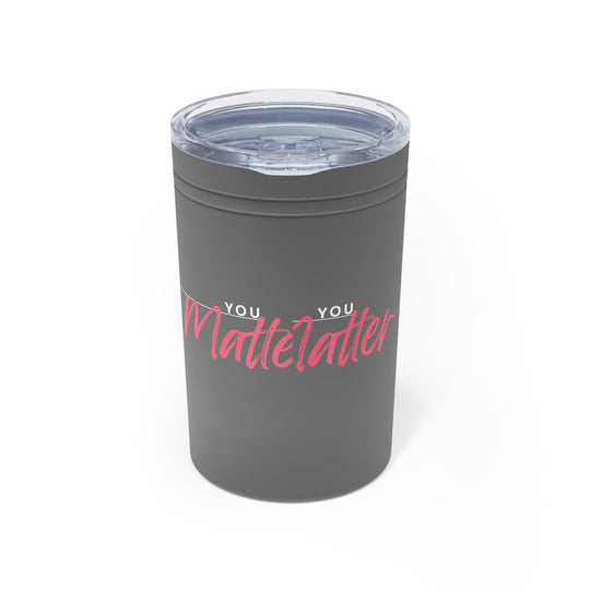 Gray tumbler with pink and white text on a white background