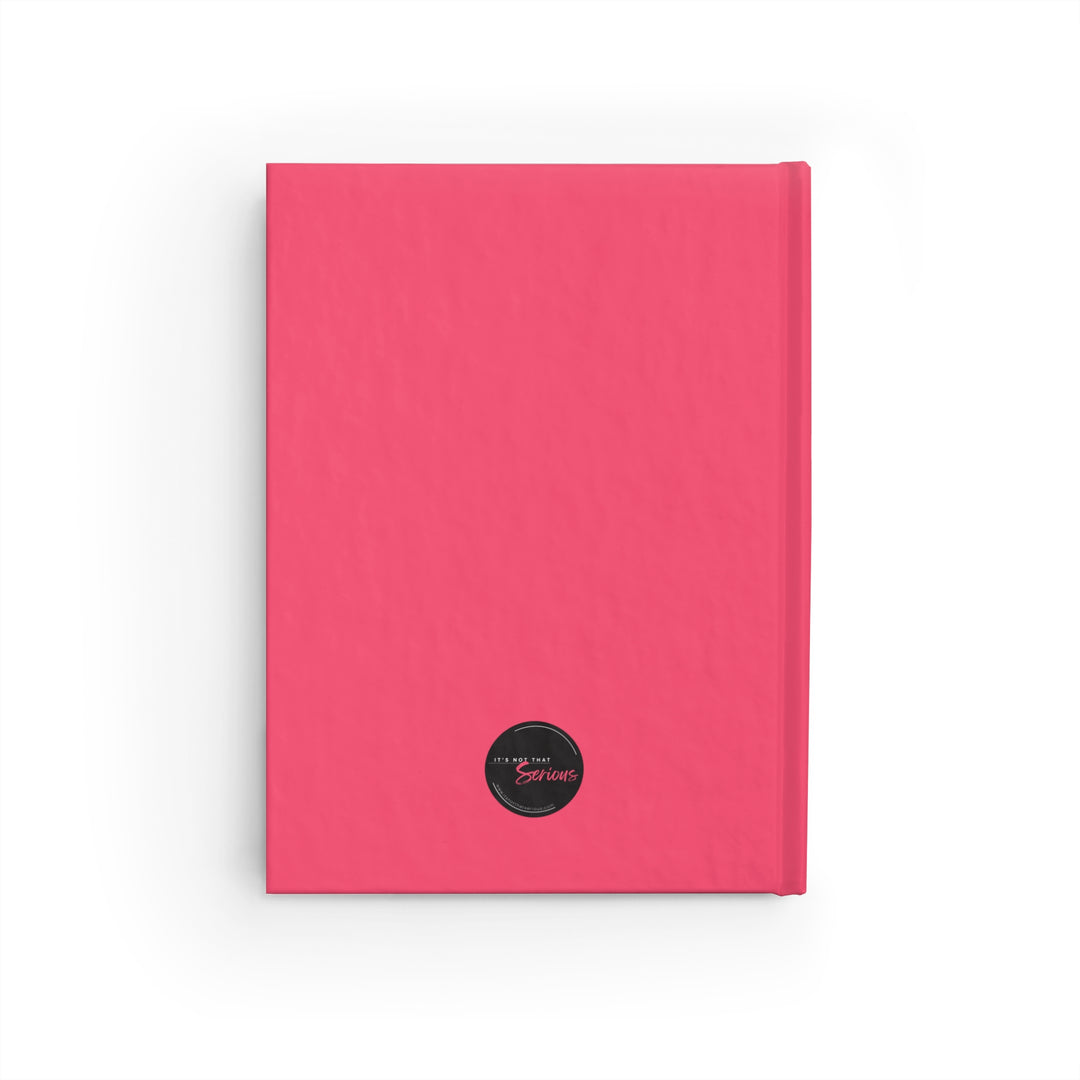 Pink notebook with a black circular label on a white background