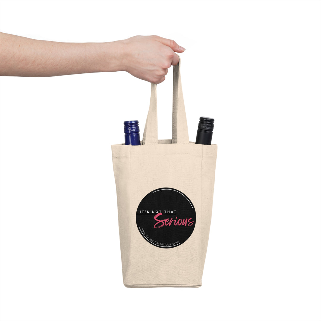 Tote bag with 'It's Not That Serious' text holding two bottles on a white background