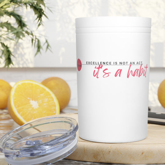 White container with motivational quote on a table with lemons and a plant in the background
