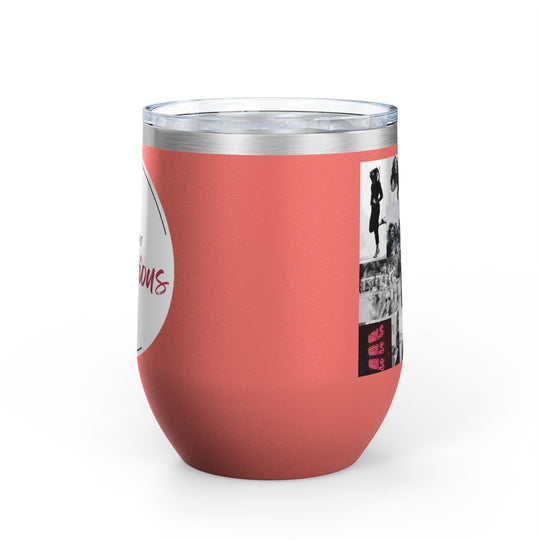 Coral-colored tumbler with a clear lid on a white background.