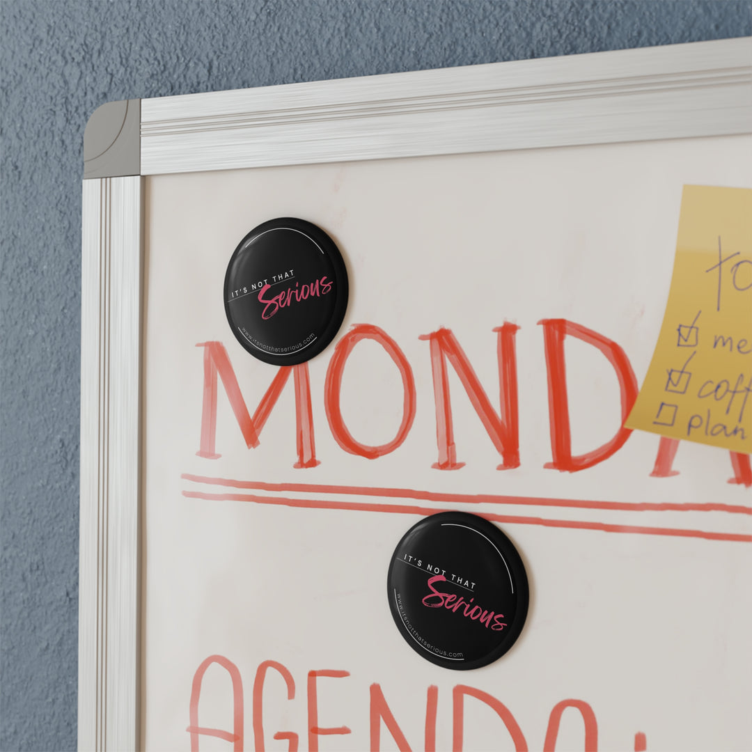 round black magnets on a whiteboard