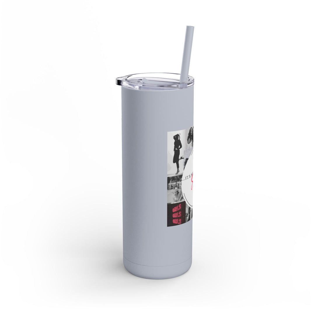 Gray tumbler with a straw featuring a graphic design on a white background