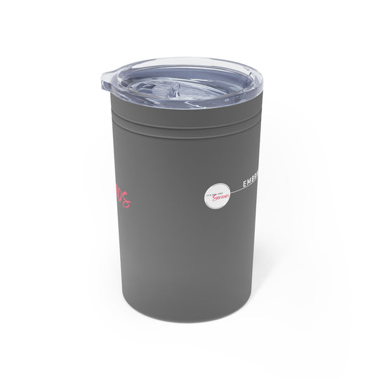 Gray tumbler with a clear lid on a white background
