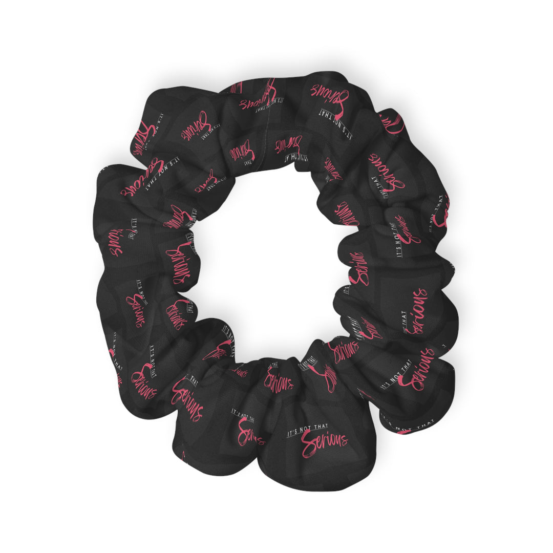 A black scrunchie with pink text all-over print, on a white background.
