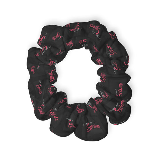 A black scrunchie with pink text all-over print, on a white background.