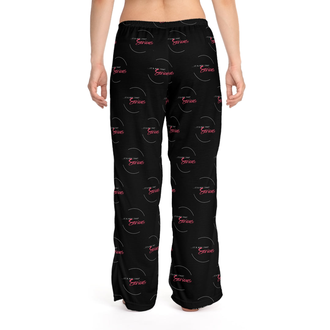 A pair of women's black pajama pants with a red and white text pattern and a drawstring waist.