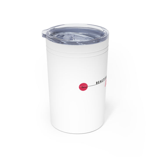 White tumbler with a clear lid on a white background