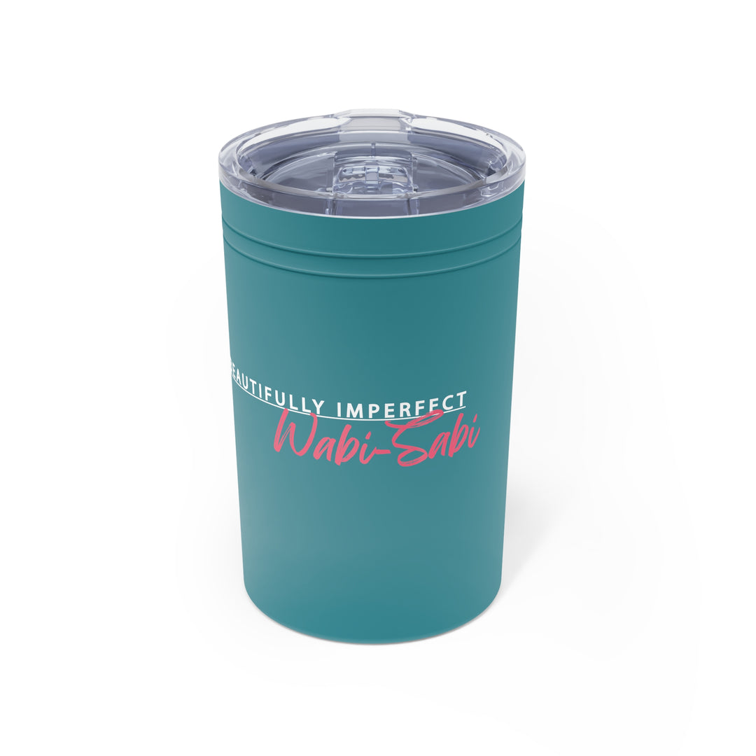 Teal tumbler with 'Wabi-Sabi' text on a white background