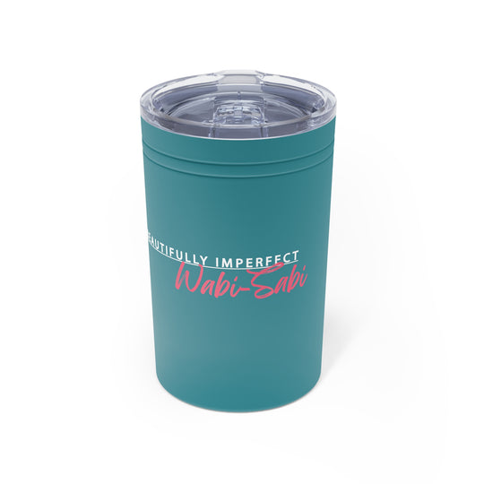 Teal tumbler with 'Wabi-Sabi' text on a white background