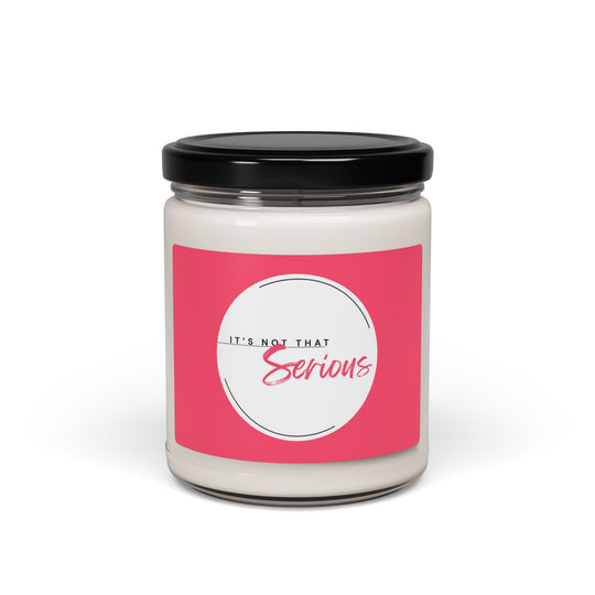 Candle jar with a pink label and black lid on a white background