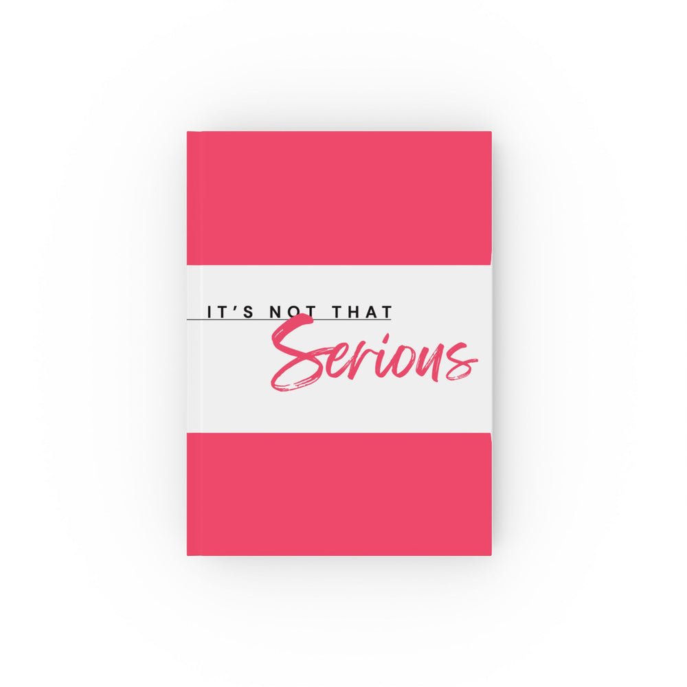 A hard backed journal with vibrant pink and white print on the cover, titled 'It's Not That Serious', 