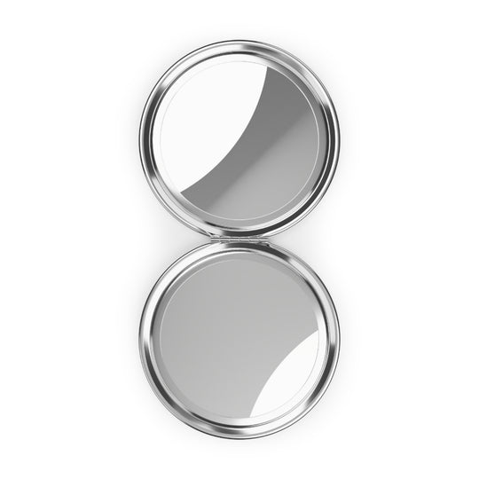 Silver compact mirror on a white background