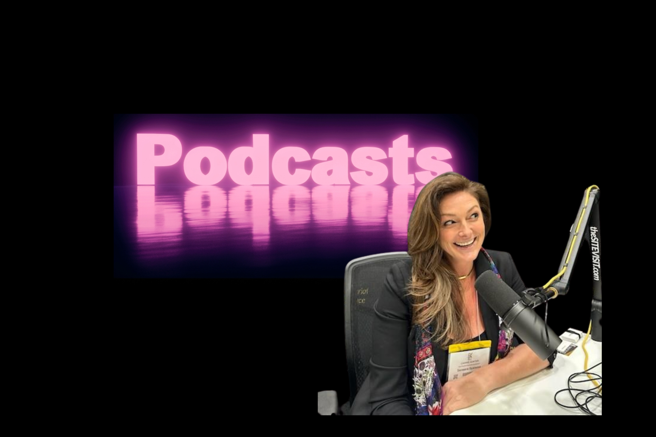 Woman sitting at a desk with a microphone, behind a neon 'Podcasts' sign.